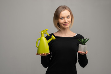watering home flowers, woman with watering can