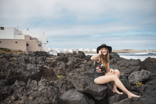 Sensual female near stormy sea