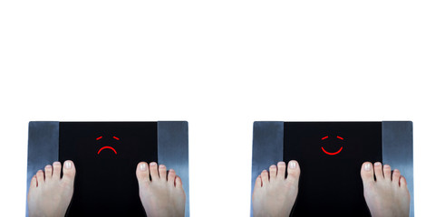 Two digital scales with female feet on them and sad and happy smiles on display. Concept of weight control before and after some fitness program or diet. Top view.