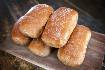 Small Loaves of Sea Salted and Buttered Fresh Baked Whole Wheat Bread