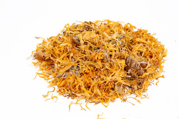 Dried calendula officinalis herbal flowers on the white background