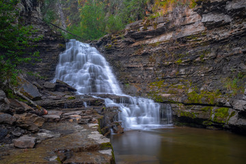 A distance shot of Quality Waterfall near Tumbler Ridge, British Columbia, Canada, long exposure to...