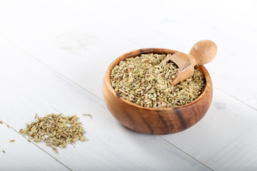 Dried Anise Seed or Aniseed in wooden bowl