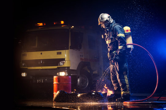 Muscular firefighter on mission
