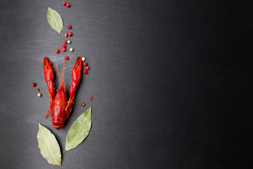 Crayfish red, Baby Lobster with herb for stir fry on black slate plate