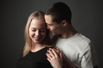 Young man and young woman in studio