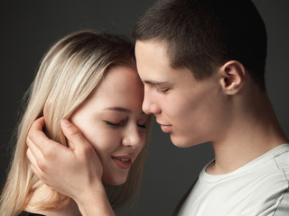 Portrait of young couple in love in studio