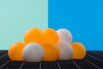 Abstract still life with orange balls on a colored background.