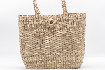 Wickerwork woman bag texture made from dry sedge isolate on white  background.Closeup surface...