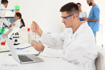 Medical student working in modern scientific laboratory