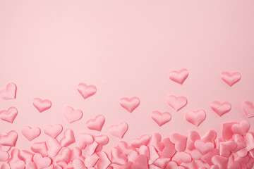 elements in shape of heart flying on pink background. symbols of love for Happy Women's, Mother's, Valentine's Day