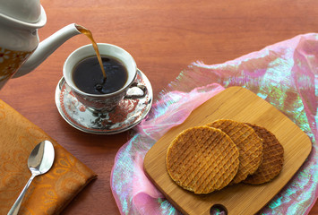 Stroopwafels with coffee served from a pitcher