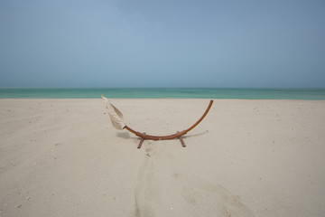 Fototapeta na wymiar empty hammock on the beach