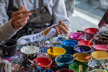Fototapeta premium hands of artist and paint