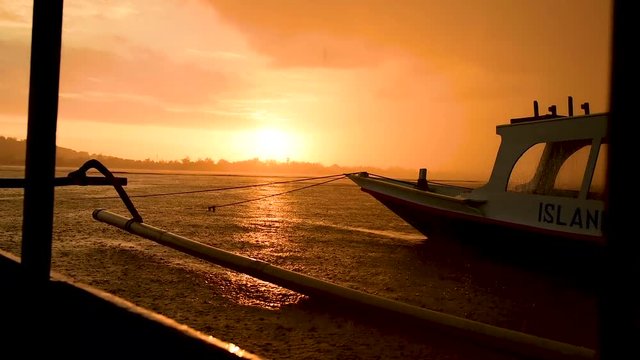heavy rain in Indonesia as sunsets by the docks, za01