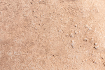 Brown dry soil or cracked ground texture background.
