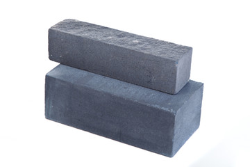 Grey long ceramic bricks at the white background, isolated