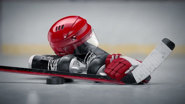 Amazing red hockey helmet, stick, puck, gloves and skates on a hockey area