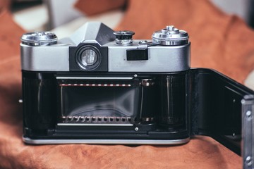 Fototapeta na wymiar retro camera with 35 mm film.