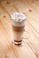 cup of coffee on the wooden background