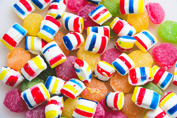 different colored round candy. Top view. Candy background. A lot of colorful candy. Pile of delicious colorful chewing candies as background