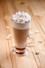 cup of coffee on the wooden background