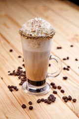 cup of coffee on the wooden background