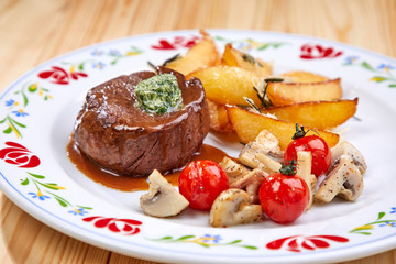 steak with baked potatoes