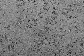 Wall fragment with scratches and cracks