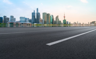Fototapeta na wymiar Empty Asphalt Road Through Modern City of Shanghai, China..