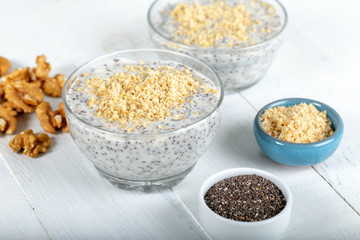 Chia pudding made with milk, banana and decorated with walnut