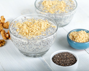 Chia pudding made with milk, banana and decorated with walnut