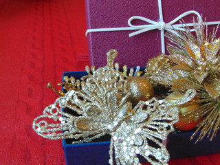 Beautiful Christmas gift boxes with gold ornaments.