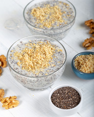 Chia pudding made with milk, banana and decorated with walnut