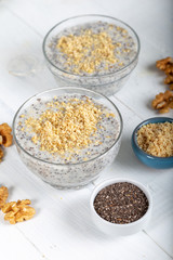 Chia pudding made with milk, banana and decorated with walnut