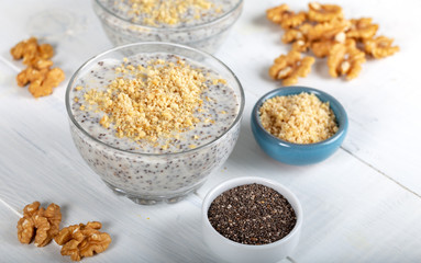 Chia pudding made with milk, banana and decorated with walnut