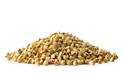 Pile of green buckwheat close up on a white. Isolated.