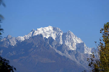 View of the snow-capped peaks of the Jade Dragon Snow Mountain. The mountain overlooking the city of Lijiang, Yunnan, China