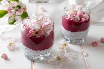 Chia pudding with blueberries and apple blossoms