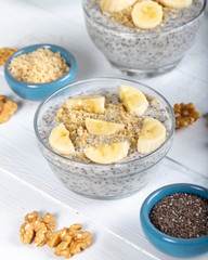 Chia pudding made with milk, banana and decorated with walnut