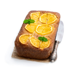 Fototapeta na wymiar Homemade orange syrup cake isolated on white