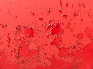 surface rouges avec peinture rouge qui s'écaille sur la surface