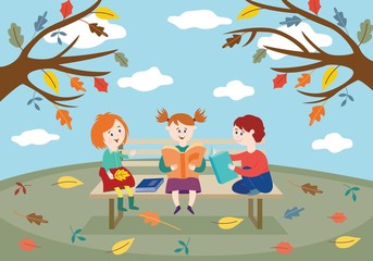 Cheerful children friends sitting on bench in autumn park or garden and reading books.