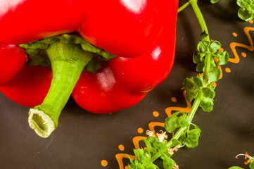 a freshest red paprika, bell pepper in ceramic plate