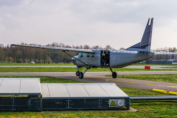airplane ready for take off with skydivers, extreme sports and hobbies, skydive entertainment