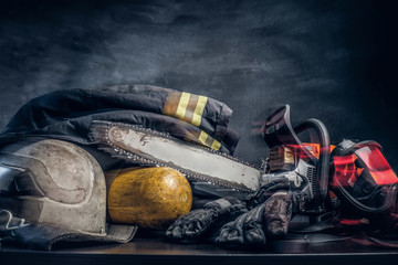 Safety gear, oxygen balon and chainsaw on the table © Fxquadro