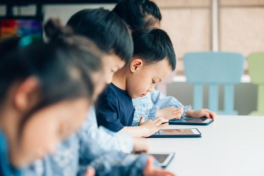Students learning with digital tablets