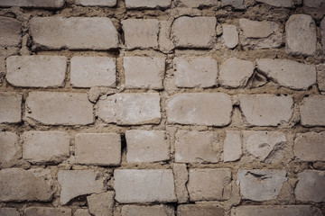 Close Up of an Old Exterior Brick Wall with Stained and Peeling White Paint