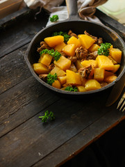 stewed potatoes with meat, goulash. stewed main course. food background. top