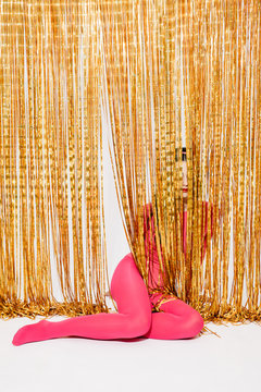 Woman sitting in string curtain
